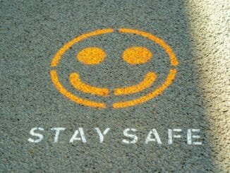 Stay safe written on the floor as Anthropic has detailed its safety strategy to try and keep its popular AI model, Claude, helpful while avoiding perpetuating harms.