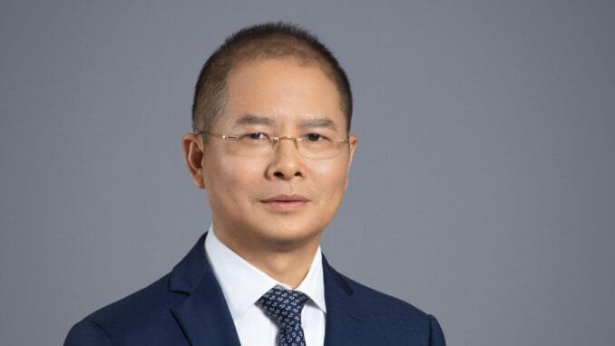 Huawei's new Ascend chips to power world's most powerful cluster Article illustration of Eric Xu of Huawei. Article concerns new Ascend chip range from the company.